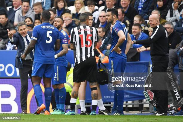 Claude Puel, Manager of Leicester City gives instructions to Wes Morgan of Leicester City during the Premier League match between Leicester City and...