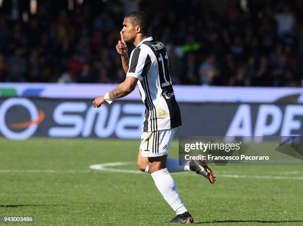 Douglas Costa of Juventus celebrates after scoring the 2-4 goal during the serie A match between Benevento Calcio and Juventus at Stadio Ciro...