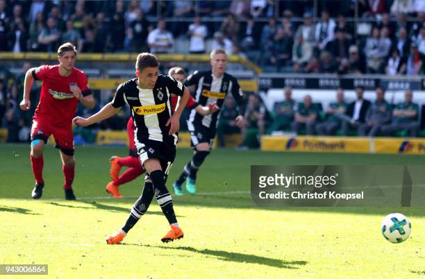 Thorgan Hazard of Moenchengladbach scores his second goal boy penalty during the Bundesliga match between Borussia Moenchengladbach and Hertha BSC at...