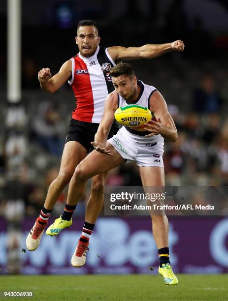 Rory Atkins of the Crows and Shane Savage of the Saints compete for the ball during the 2018 AFL round 03 match between the St Kilda Saints and the...