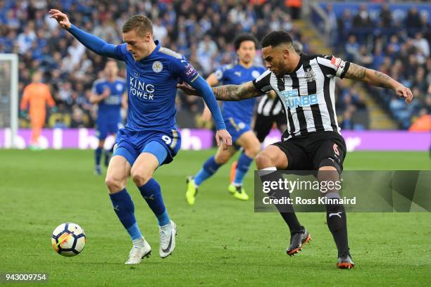 Jamie Vardy of Leicester City is challenged by Jamaal Lascelles of Newcastle United during the Premier League match between Leicester City and...