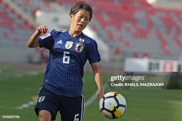 Japan's defender Saori Ariyoshi drives the ball during the AFC Women's Asian Cup football match Japan vs Vietnam on April 7, 2018 in the Jordanian...