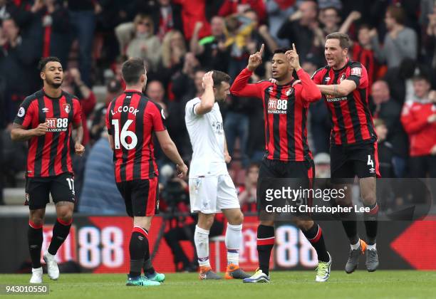 Lys Mousset of AFC Bournemouth celebrates with teammate Dan Gosling after scoring his sides first goal during the Premier League match between AFC...