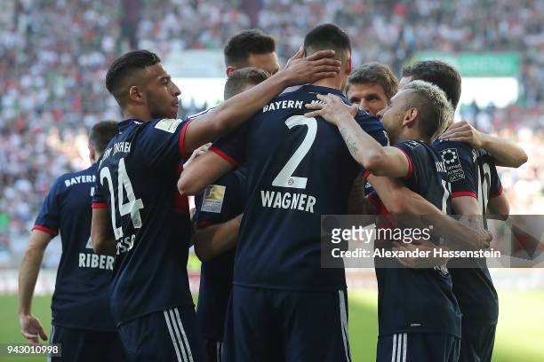 Sandro Wagner of Muenchen ) celebrates with his team after he scored a goal to make it 1:4 during the Bundesliga match between FC Augsburg and FC...