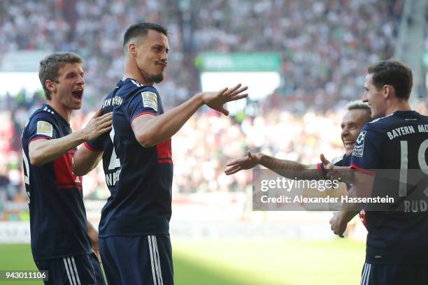 Sandro Wagner of Muenchen celebrates after he scored a goal to make it 1:4 during the Bundesliga match between FC Augsburg and FC Bayern Muenchen at...