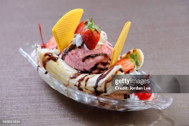 banana split, and ice cream dessert with toppings - banana split stock pictures, royalty-free photos & images