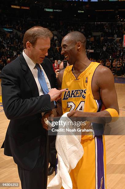 Head Coach Kurt Rambis of the Minnesota Timberwolves shares a laugh with Kobe Bryant of the Los Angeles Lakers following their game at Staples Center...