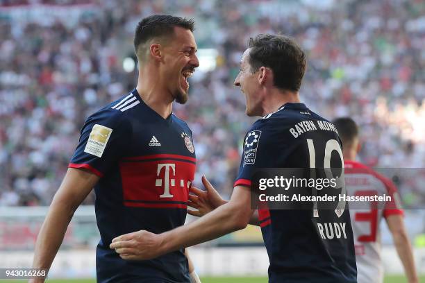 Sandro Wagner of Muenchen celebrates with Sebastian Rudy of Bayern Muenchen after he scored a goal to make it 1:4 during the Bundesliga match between...