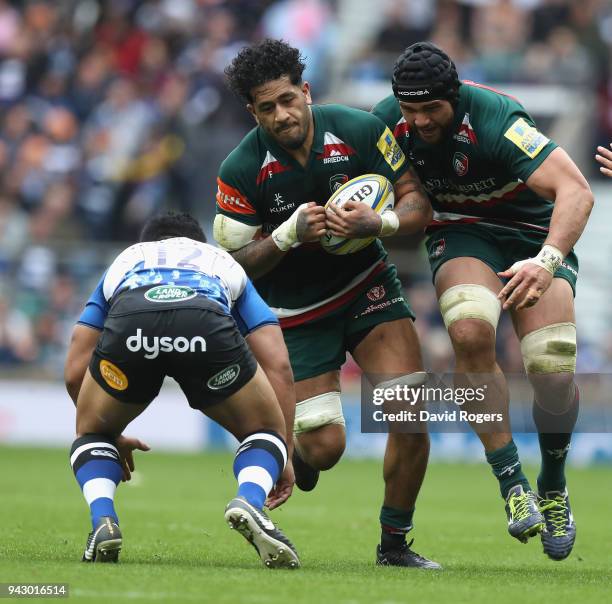 Valentino Mapapalangi of Leicester takes on Ben Tapuai with Sione Kalamafoni in support during the Aviva Premiership match between Bath Rugby and...