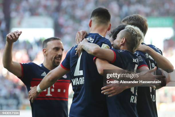 Sandro Wagner of Muenchen ) celebrates with his team after he scored a goal to make it 1:4 during the Bundesliga match between FC Augsburg and FC...