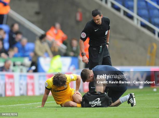 Preston North End's Ben Pearson receives treatment to an injury during the Sky Bet Championship match between Reading and Preston North End at...