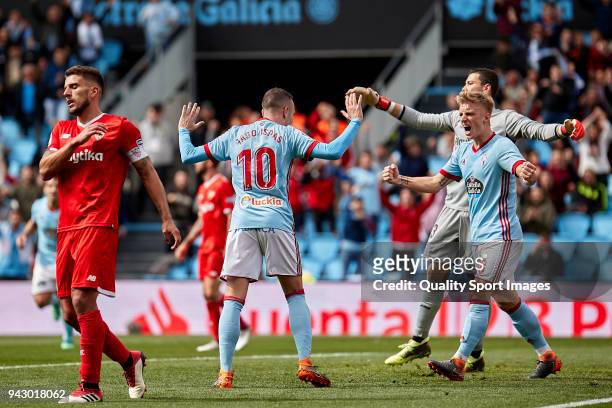 Iago Aspas and Daniel Wass of Celta de Vigo celebrate Guilherme Arana of Sevilla FC scores by own goal during the La Liga match between Celta de Vigo...