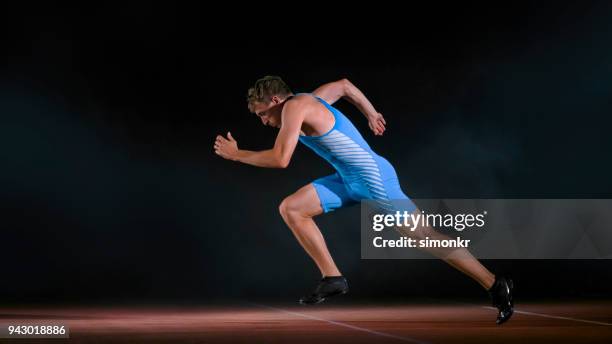 Male Sprinters On Starting Blocks Side View Photos and Premium High Res ...