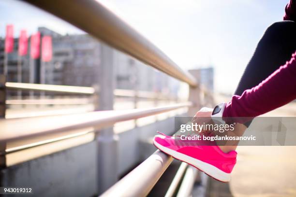 female athlete - untied shoelace stock pictures, royalty-free photos & images