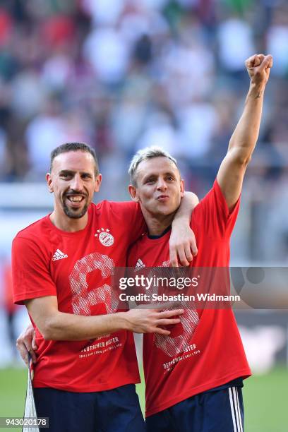 Franck Ribery and Rafinha of Bayern Muenchen celebrate after the Bundesliga match between FC Augsburg and FC Bayern Muenchen at WWK-Arena on April 7,...