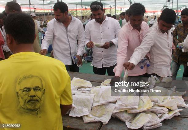 Free food stall for supporters and workers during the grand celebration of party's 38th foundation day, at BKC ground, on April 6, 2018 in Mumbai,...