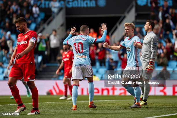 Iago Aspas and Daniel Wass of Celta de Vigo celebrate Guilherme Arana of Sevilla FC scores by own goal during the La Liga match between Celta de Vigo...
