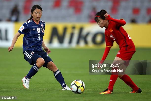 Aya Sameshima of Japan and Pham Hoang Quynh of Vietnam in action during the AFC Women's Asian Cup Group B match between Japan and Vietnam at the King...