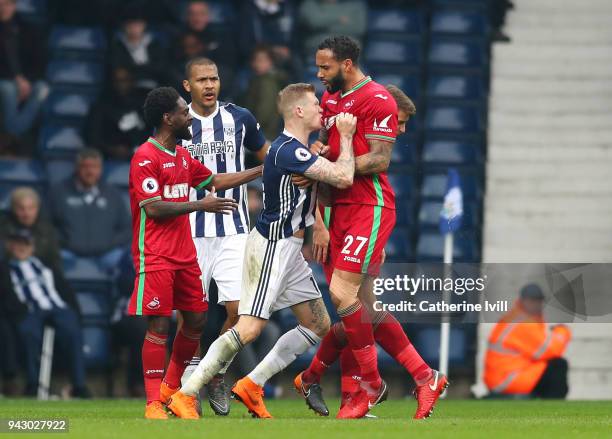 James McClean of West Bromwich Albion clashes with Kyle Bartley of Swansea City during the Premier League match between West Bromwich Albion and...