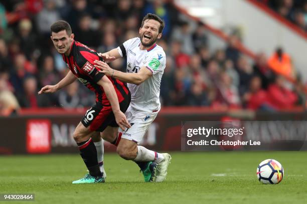 Yohan Cabaye of Crystal Palace and Lewis Cook of AFC Bournemouth battle for the ball during the Premier League match between AFC Bournemouth and...