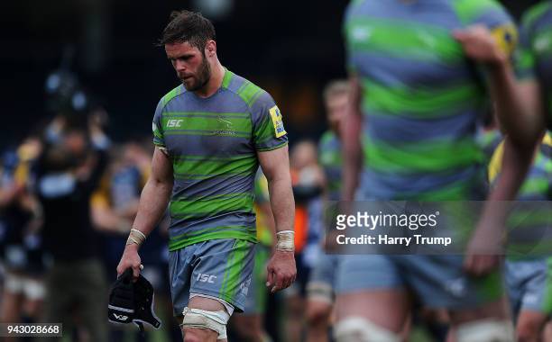 Members of the Newcastle Falcons side cut dejected figures at the final whistle during the Aviva Premiership match between Worcester Warriors and...