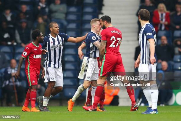 James McClean of West Bromwich Albion clashes with Kyle Bartley of Swansea City during the Premier League match between West Bromwich Albion and...