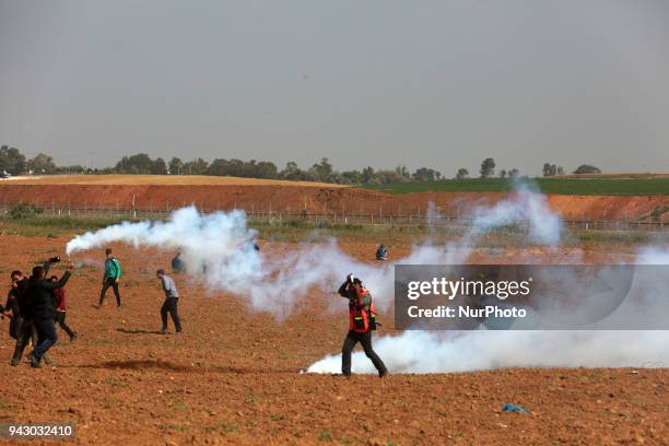 Palestinians protesters during clashes with Israeli toops near the border with Israel in the east of Jabaliya refugee camp in the northern Gaza...