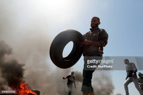 Palestinians protesters during clashes with Israeli toops near the border with Israel in the east of Jabaliya refugee camp in the northern Gaza...