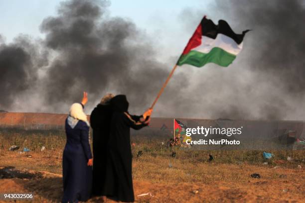 Palestinians protesters during clashes with Israeli toops near the border with Israel in the east of Jabaliya refugee camp in the northern Gaza...