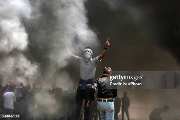 Palestinians protesters during clashes with Israeli toops near the border with Israel in the east of Jabaliya refugee camp in the northern Gaza...