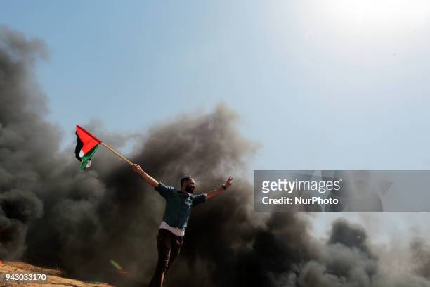 Palestinians protesters during clashes with Israeli toops near the border with Israel in the east of Jabaliya refugee camp in the northern Gaza...