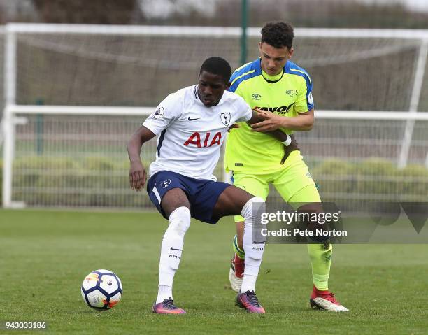 Shilow Tracey of Tottenham Hotspur controls the ball under pressure from Lee Buchanan of Derby County during the Premier League 2 match between...