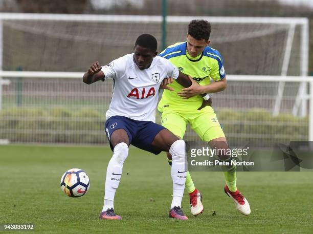 Shilow Tracey of Tottenham Hotspur controls the ball under pressure from Lee Buchanan of Derby County during the Premier League 2 match between...