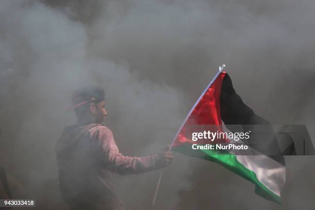 Palestinians protesters during clashes with Israeli toops near the border with Israel in the east of Jabaliya refugee camp in the northern Gaza...