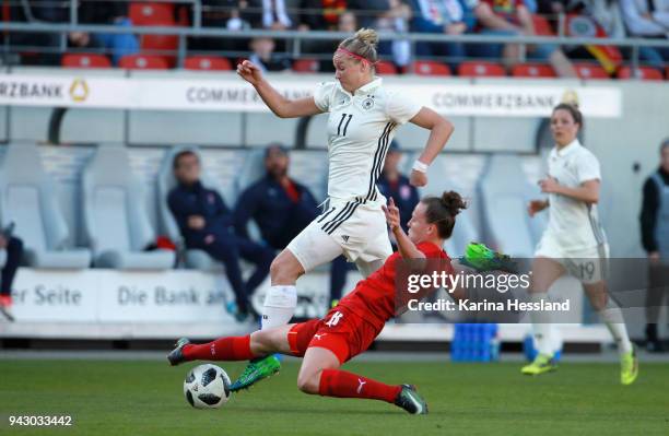 Alexandra Popp of Germany is challenged by Jana Sedlackova of Czech Republic during the 2019 FIFA Womens World Championship Qualifier match between...