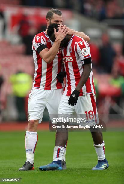 Erik Pieters and Mame Biram Diouf of Stoke City react after the Premier League match between Stoke City and Tottenham Hotspur at Bet365 Stadium on...