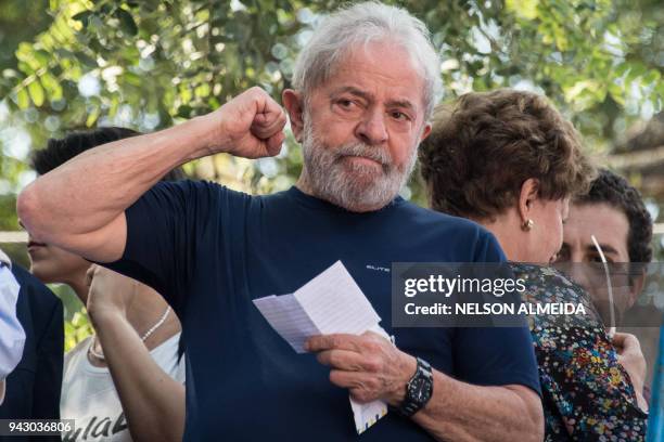 Brazilian ex-president Luiz Inacio Lula da Silva gestures after attending a Catholic Mass in memory of his late wife Marisa Leticia, at the...