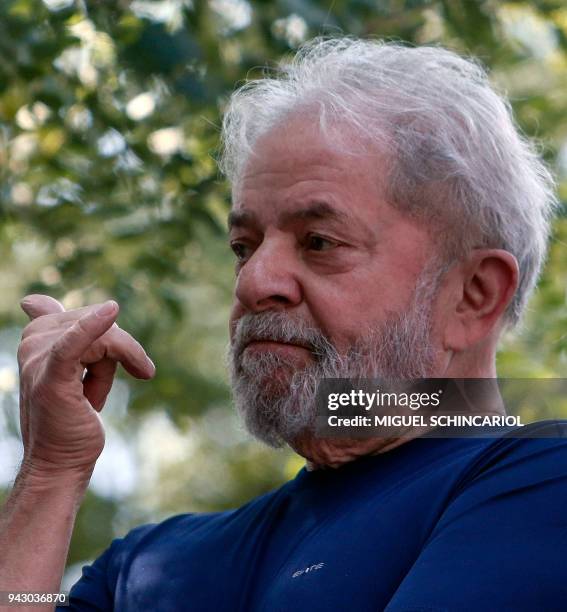Brazilian ex-president Luiz Inacio Lula da Silva gestures after attending a Catholic Mass in memory of his late wife Marisa Leticia, at the...