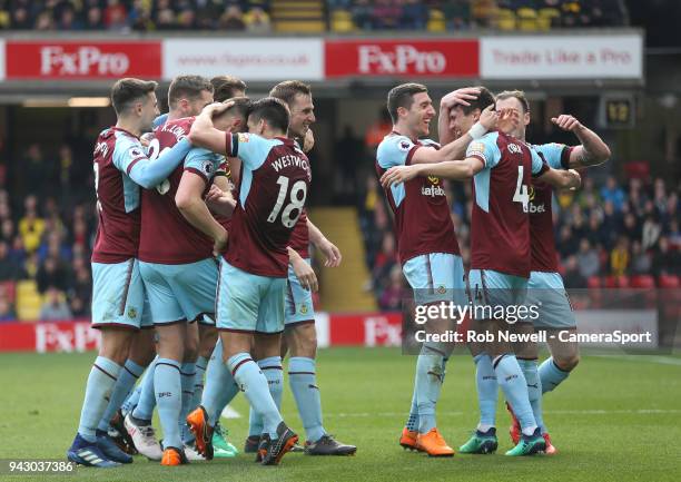 Burnley's Jack Cork is congratulated after scoring his side's second goal during the Premier League match between Watford and Burnley at Vicarage...