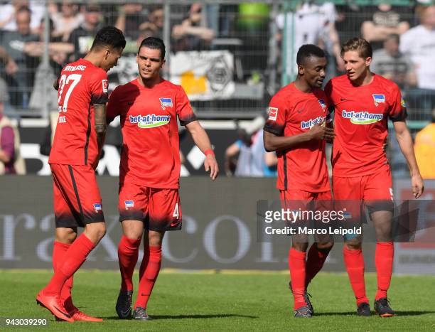 Davie Selke, Karim Rekik, Salomon Kalou and Niklas Stark of Hertha BSC celebrate after scoring the 0:1 during the Bundesliga game between Borussia...