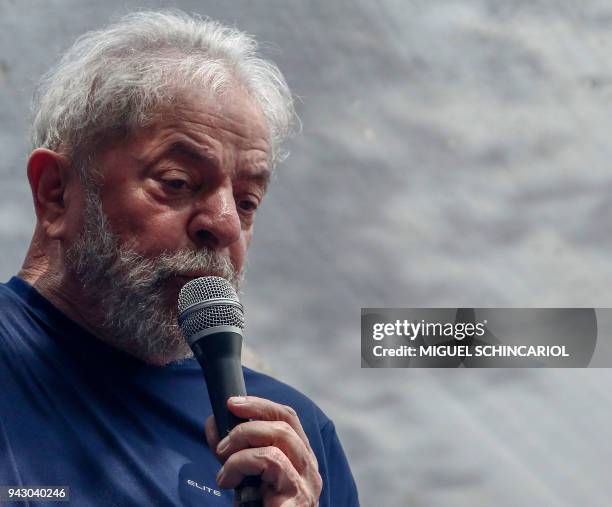 Brazilian ex-president Luiz Inacio Lula da Silva speaks to supporters after attending a Catholic Mass in memory of his late wife Marisa Leticia, at...