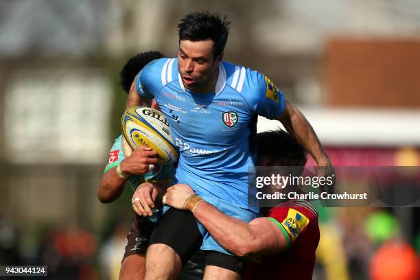 James Marshall of London Irish looks to break through the Harlequins defence line during the Aviva Premiership match between Harlequins and London...