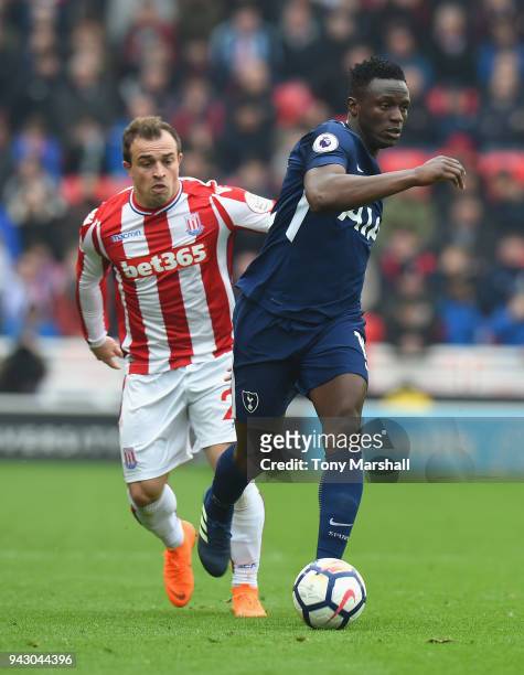 Xherdan Shaqiri of Stoke City challenges Victor Wanyama of Tottenham Hotspur during the Premier League match between Stoke City and Tottenham Hotspur...