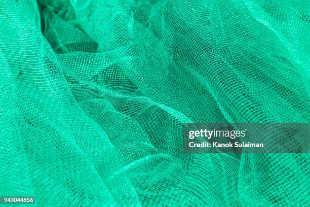 close up of fishing nets - rede têxtil imagens e fotografias de stock