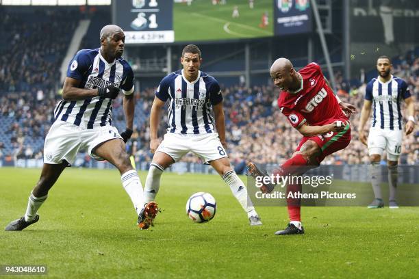 Andre Ayew of Swansea City is challenged by Allan Nyom of West Bromwich Albion during the Premier League match between Swansea City and West Bromwich...