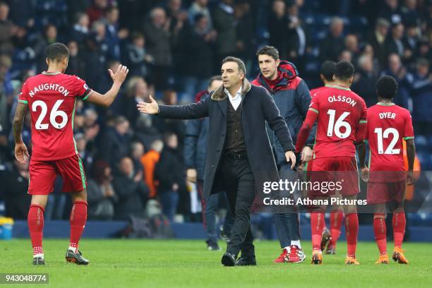 Swansea City manager Carlos Carvalhal high fives Kyle Naughton of Swansea City after the final whistle of the Premier League match between Swansea...