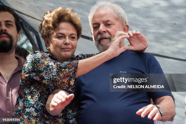 Brazilian ex-president Luiz Inacio Lula da Silva and Brazilian former president Dilma Rousseff gesture after during a Catholic Mass in memory of...