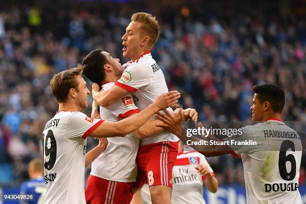 Filip Kostic of Hamburg celebrates with Lewis Holtby of Hamburg and his team after he scored a goal to make it 1:1 during the Bundesliga match...