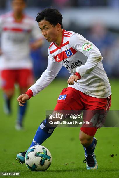 Tatsuya Ito of Hamburg runs with ball during the Bundesliga match between Hamburger SV and FC Schalke 04 at Volksparkstadion on April 7, 2018 in...