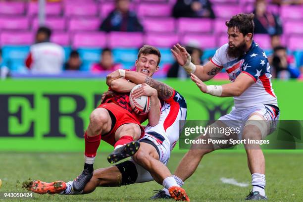 Morgan Williams of Wales fights with Martin Iosefo of USA during the HSBC Hong Kong Sevens 2018 match between USA and Wales on April 7, 2018 in Hong...
